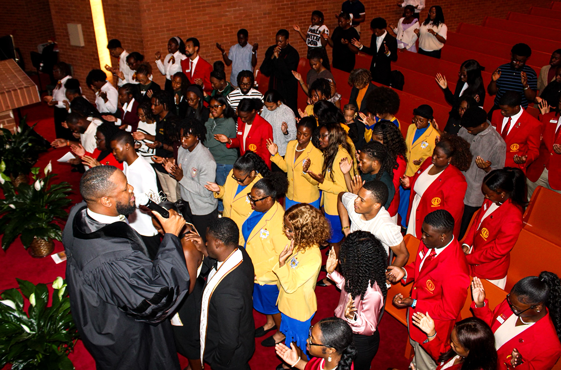 The Dean and students at a service in the Chapel