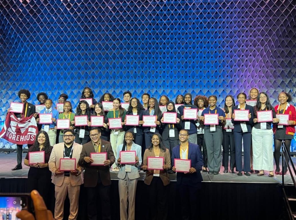 Group of Students holding up certificates