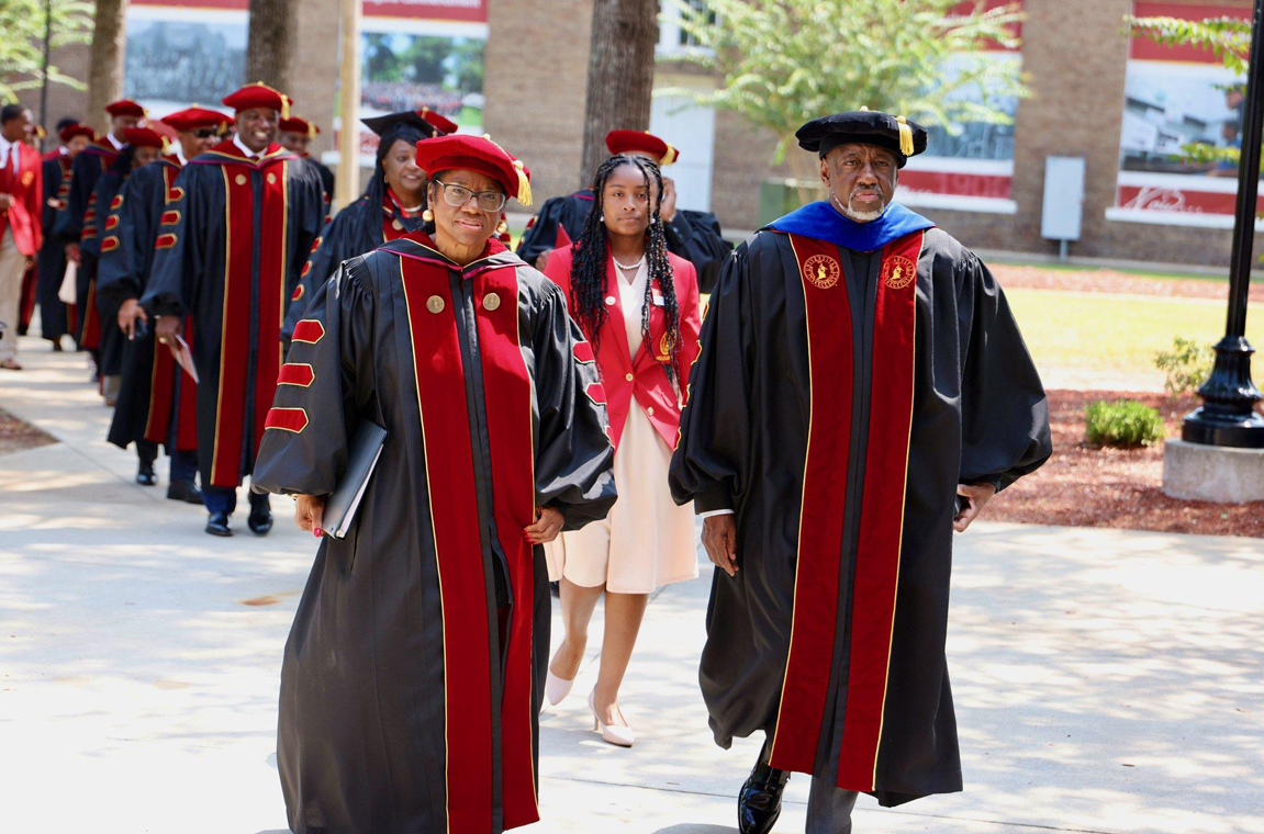 Board of Trustees Chair Norma Clayton and Dr. Mark A. Brown lead the Investiture procession to the venue