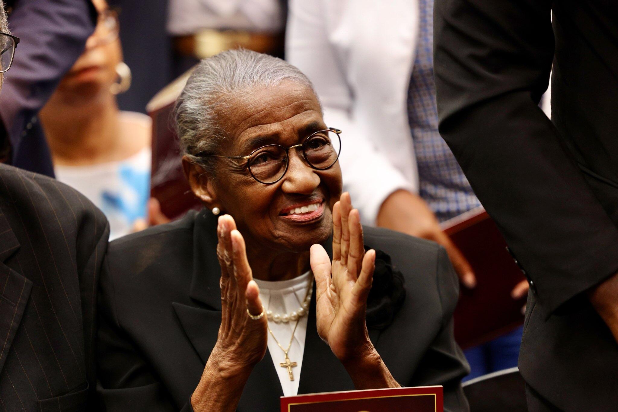 Dr. Brown's mother smiling and clapping
