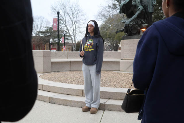 Female student speaking during the vigil