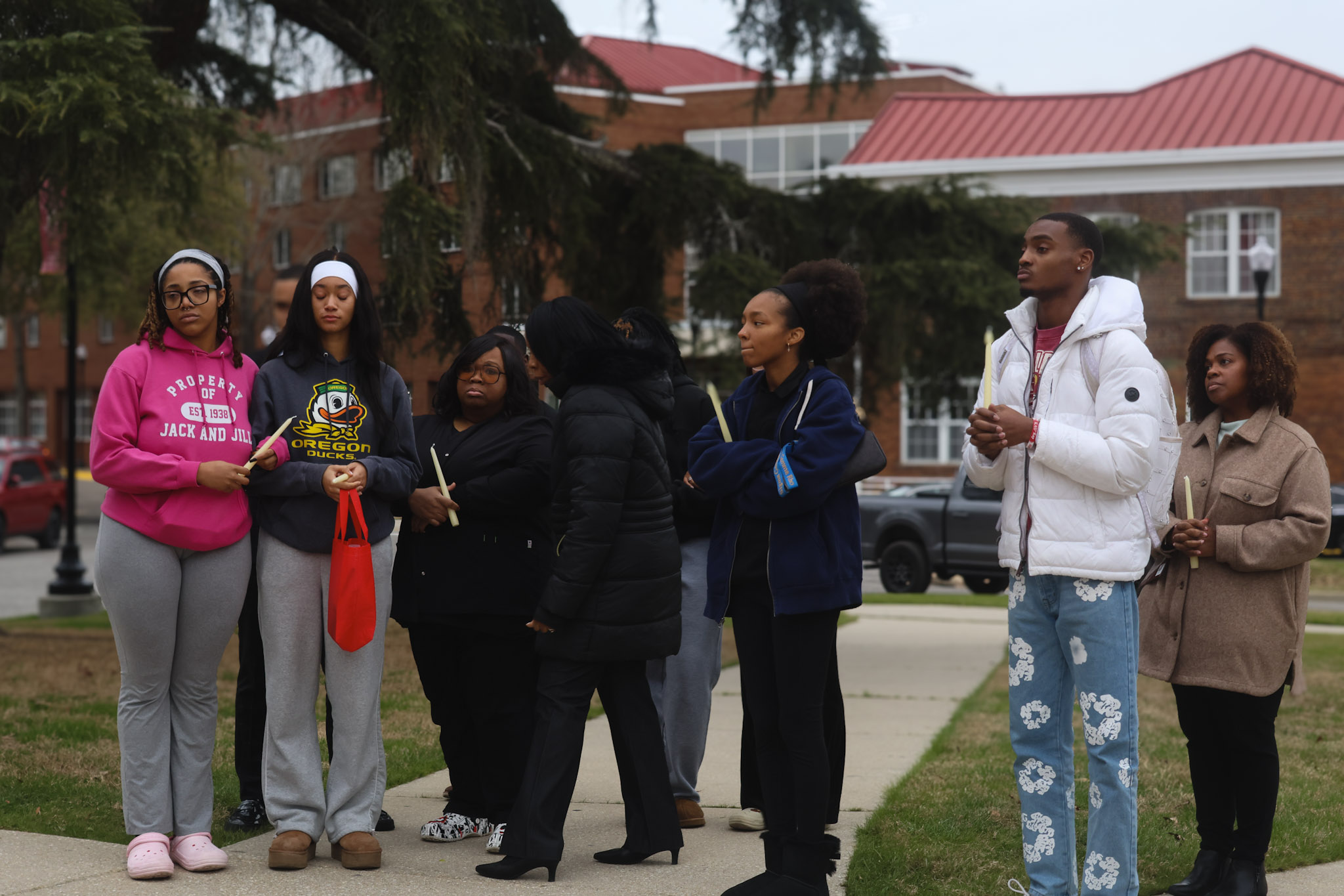 Students holding candles at the vigil
