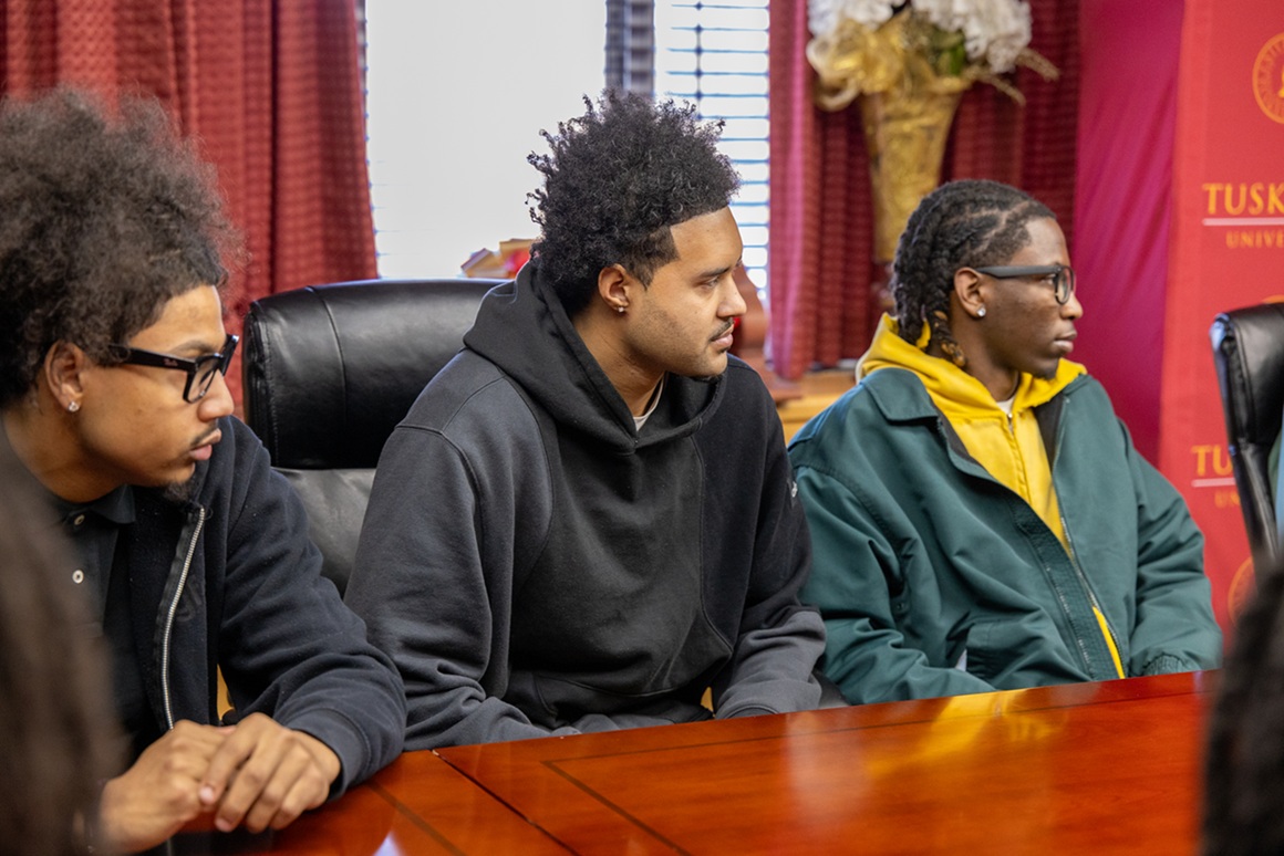 MBB players seated around the table during meeting with Dr. Brown_pic3