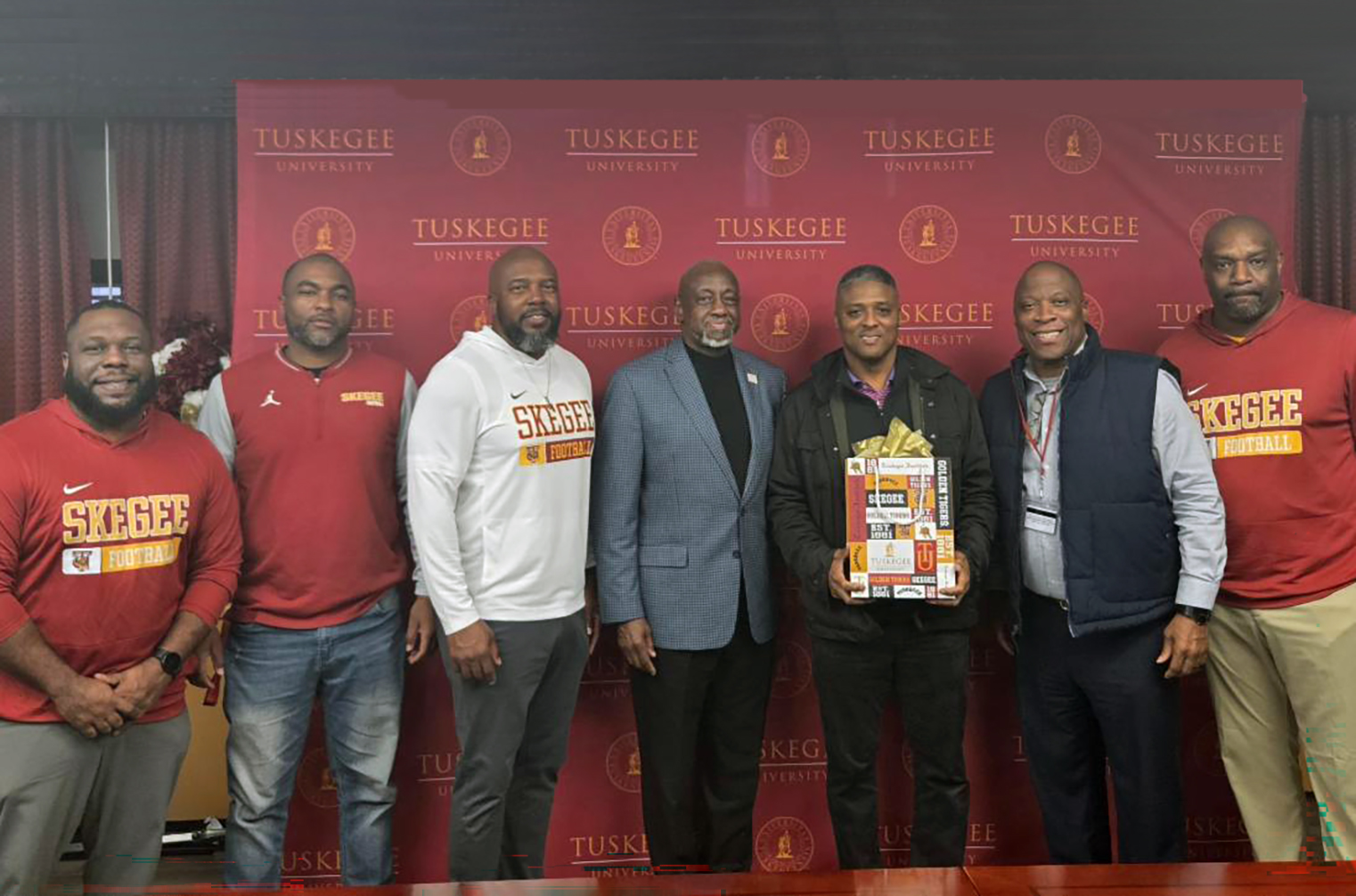 Warrick Dunn with Dr. Mark Brown, VP Reginald Ruffin, and Golden Tiger football coaching staff