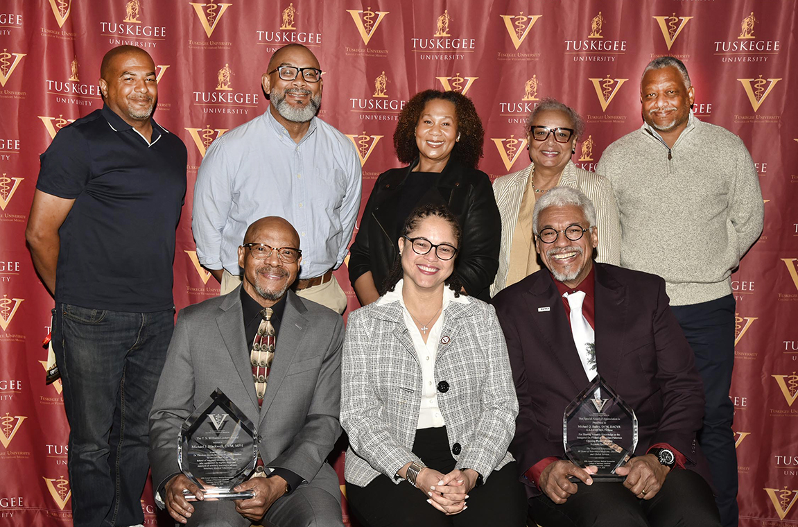 Dr. Patterson's family, Dr. Gilbreath, Dr. Blackwell, and Dr. Bailey holding awards