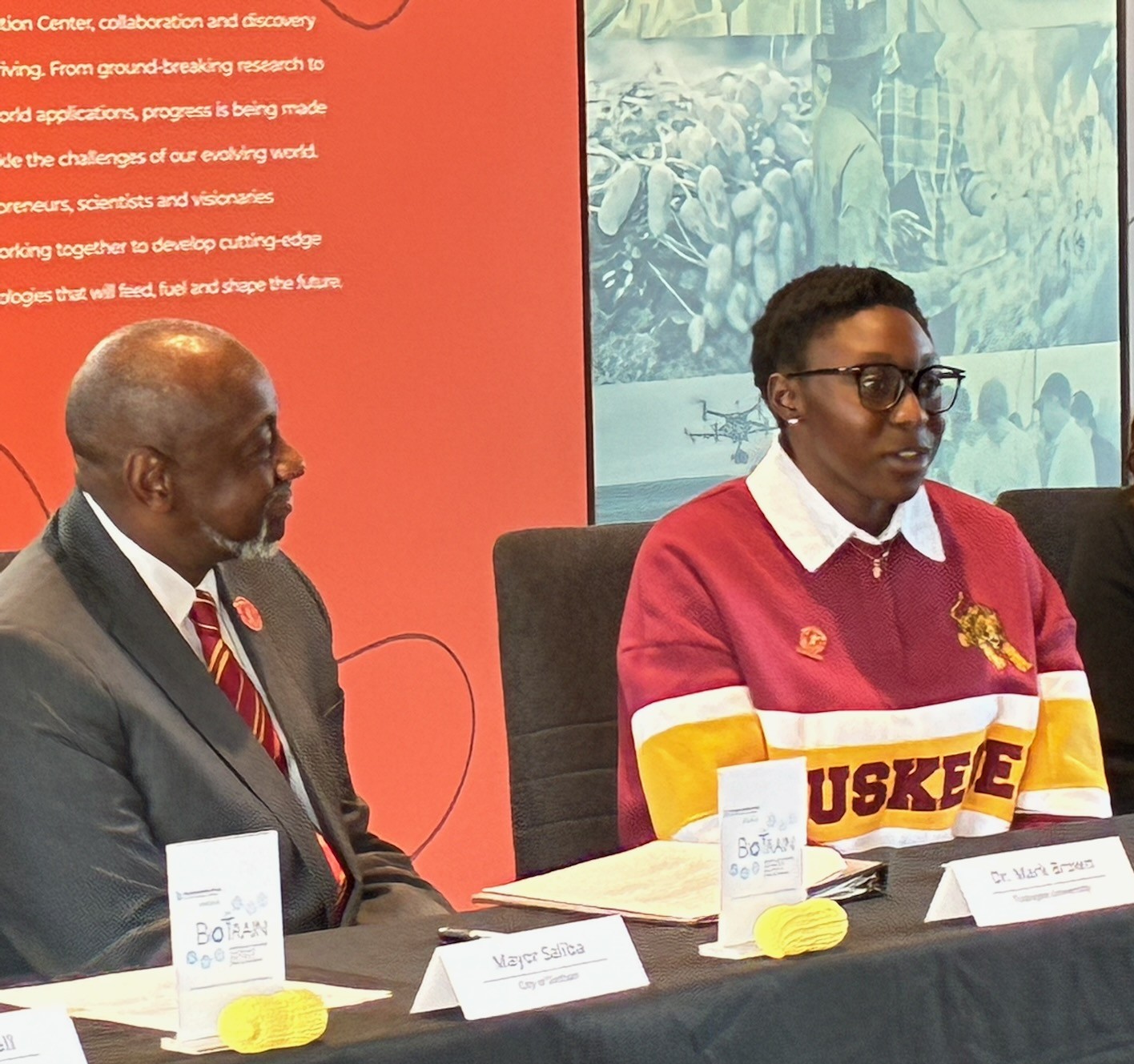 Tuskegee student speaks as Dr. Brown looks on