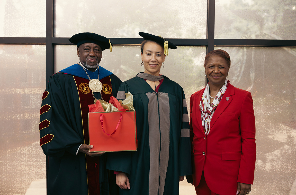 Dr. Mark A. Brown and Mrs. Gwen Brown present gift to Graduate Ceremony Speaker