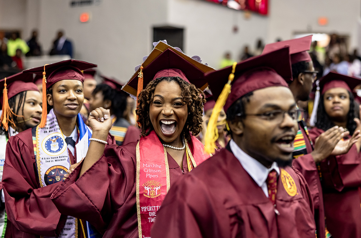 Male and female graduates in the line of march during Commencement processional