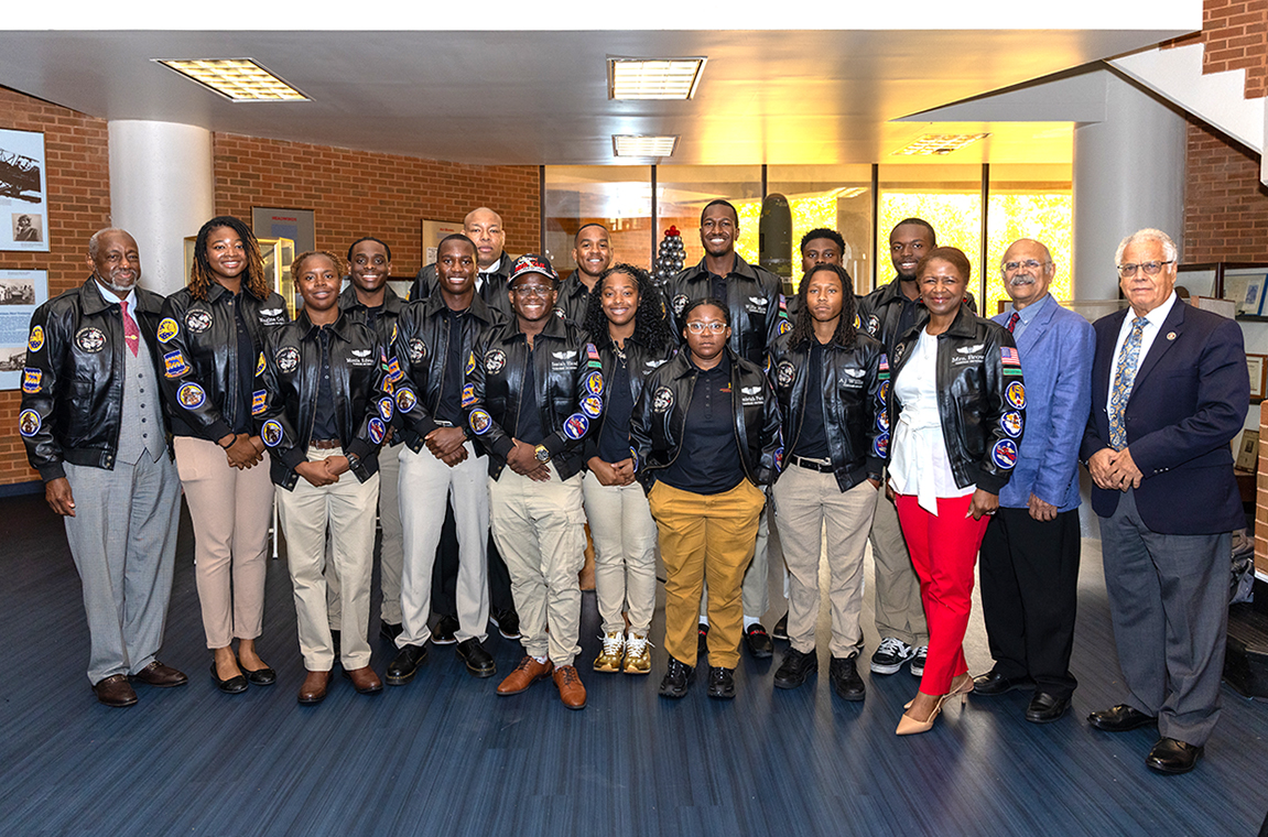 Dr. and Mrs. Brown, Capt, Sanders, Dean Aglan, and Dr. Khan with student aviators who received jackets