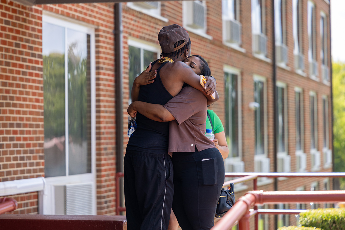 A mom shares a final hug with her son before she leaves