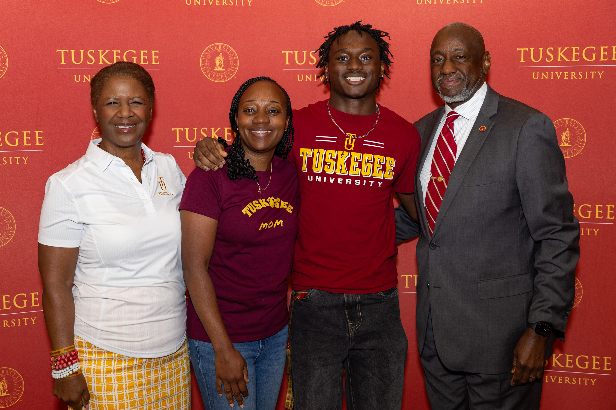 Dr. and Mrs. Brown with a new student and his mom