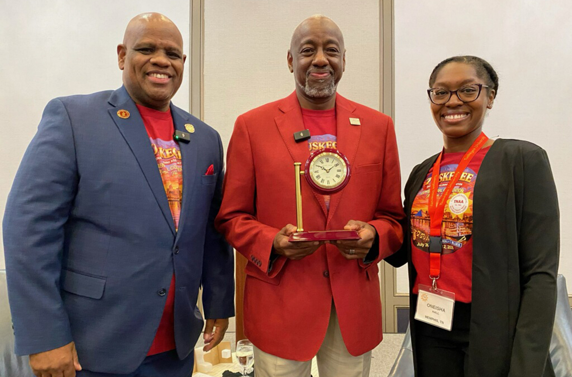 Dr. Quincy and Oneisha Hall, President, Memphis Tuskegee Alumni Club present token