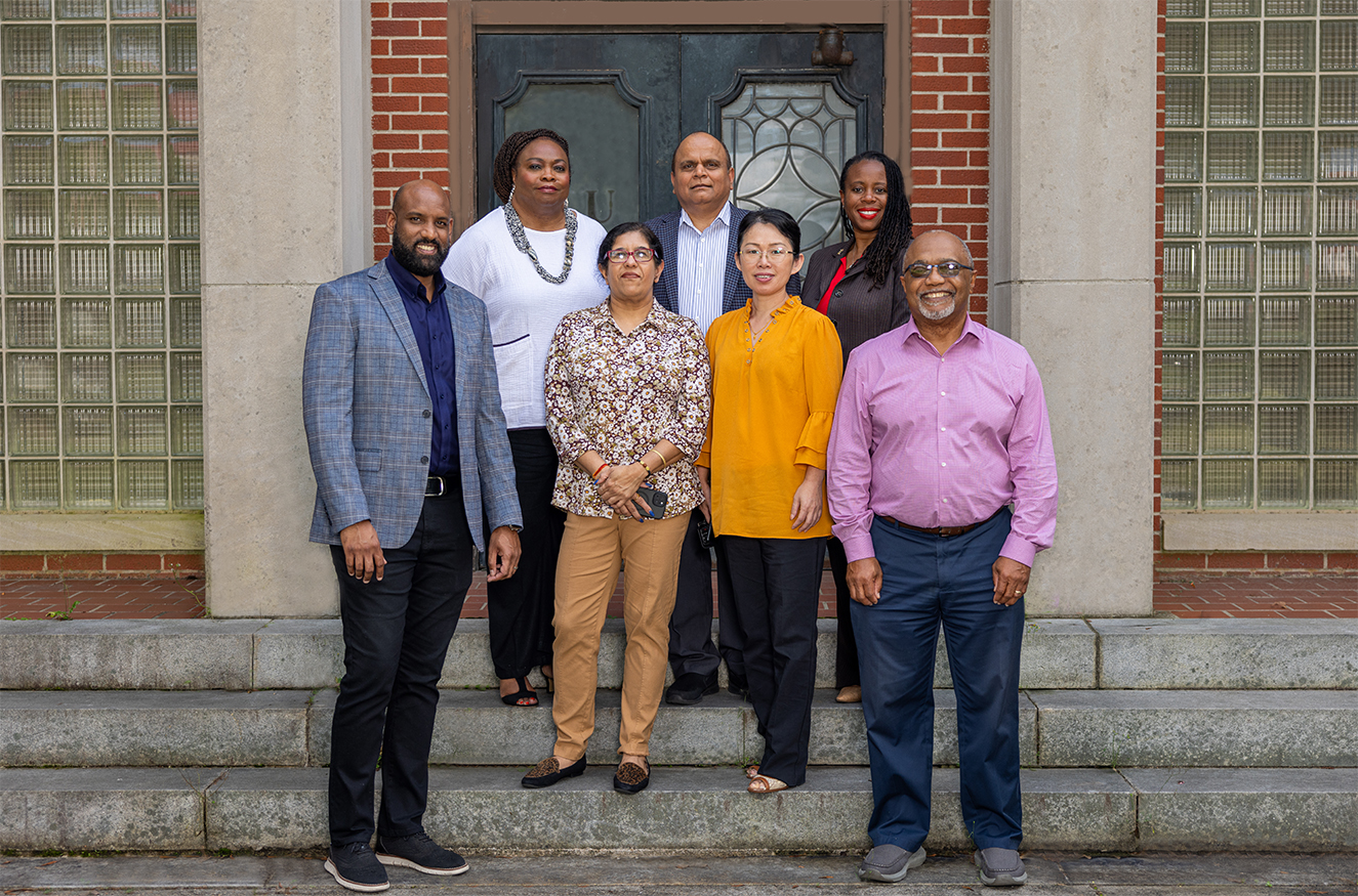 Researchers and department heads standing outside of the Carver Foundation