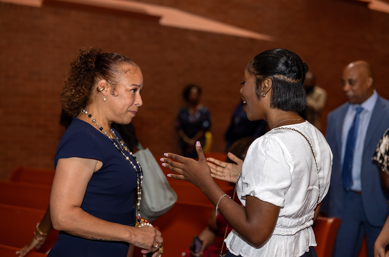Collette V. Smith in conversation with a female student