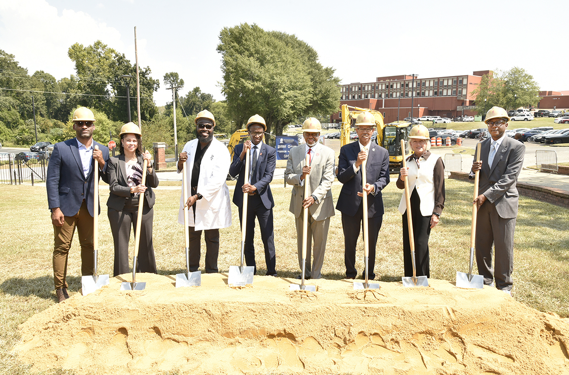 Picture of university and city officials and projects managers with shovels 